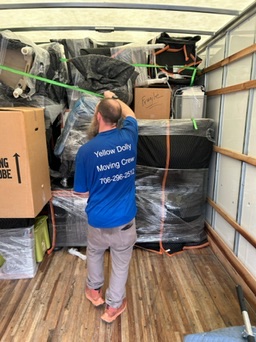 professional mover loading up a penske moving truck
