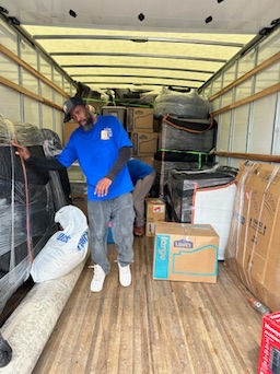 mover standing in a moving truck